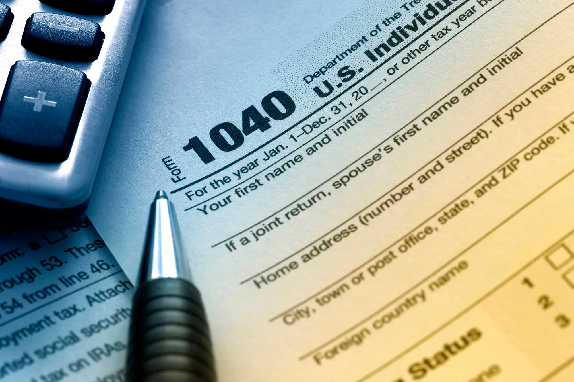 Form 1040 individual tax return with calculator